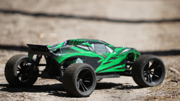 istock radio-controlled racing green car forest track competition 1224327628
