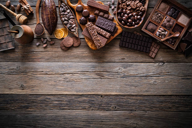 istock Assorted chocolate products with bars cocoa beans nuts spices rustic 1224327743