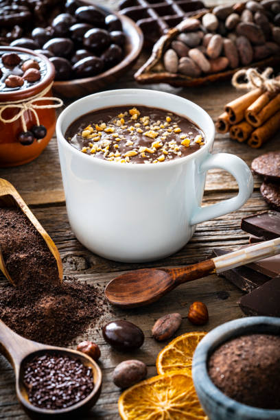 istock Melted chocolate cup and cocoa beans and pod with assorted chocolate 1224327833