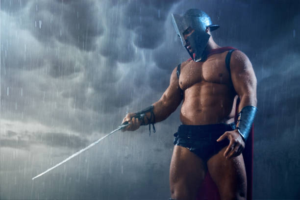 istock Muscular spartan pointing sword. 1224329326