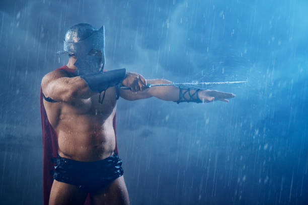 istock Muscular spartan pointing sword. 1224329348