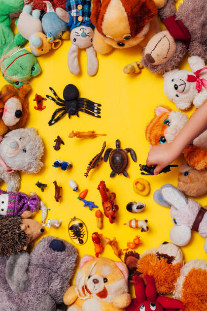 istock Children's soft toys for developing baby games on a yellow background 1224329507