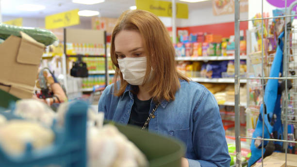 istock woman Buyer wearing a protective mask. 1224331116