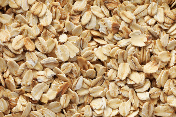 istock Oatmeal flakes texture on whole background, close up 1224332076