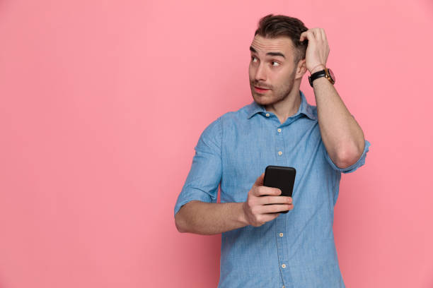 istock casual man scratching his head, looking aside 1224332263