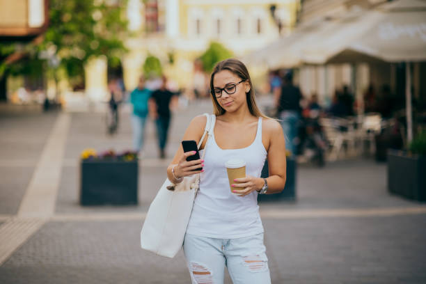 istock Woman using smartphone in the city 1224332587