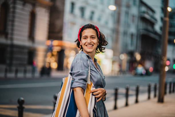 istock Smiling woman with reusable shopping bag 1224333802