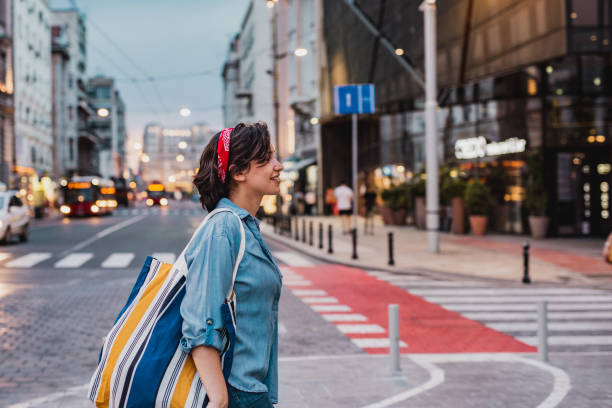 istock Smiling woman with reusable shopping bag 1224333978