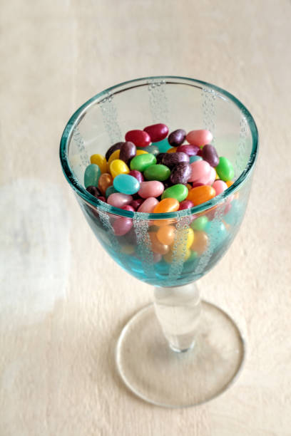 istock Wine goblet of Rainbow colored jellybeans 1224334639