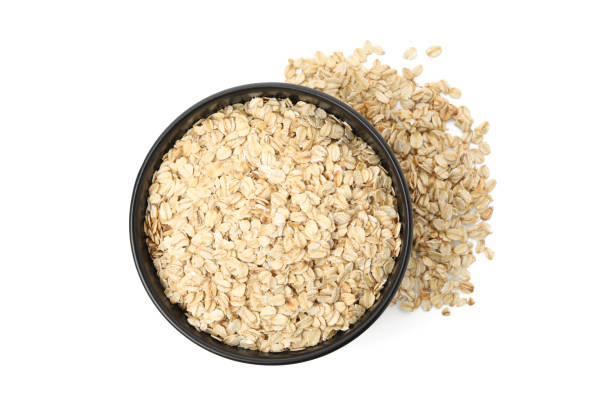 istock Bowl with oatmeal flakes isolated on white background 1224335698