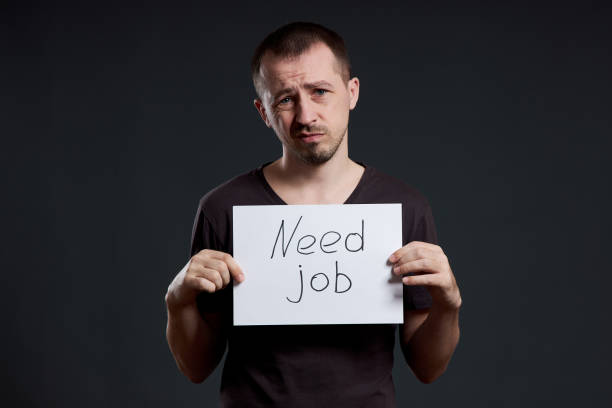 istock Man is looking for work, unemployment and crisis. Different emotions on the face, a sign in the hands 1224335821