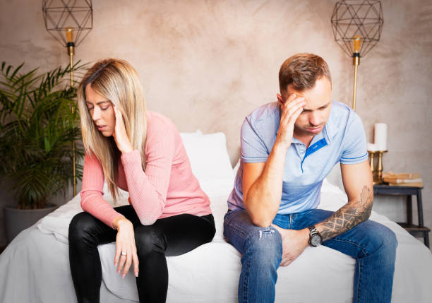 istock Couple sitting on bed and don't speak 1224336422