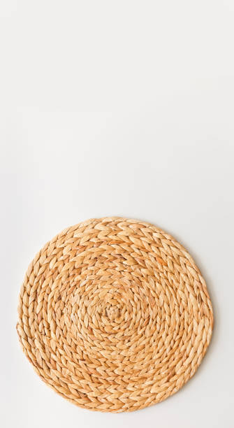 istock Wicker straw stand isolated on white background. Upright photo as flat lay, top view minimal social media template 1224336582