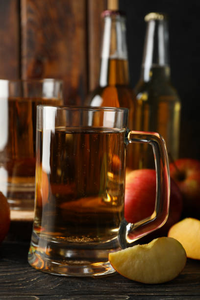 istock Composition with cider and apples on wooden background 1224337627