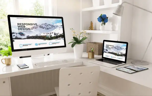 Photo of home office set up with responsive snow mountain website