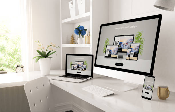 responsive devices on home desktop showing web design website - web design imagens e fotografias de stock
