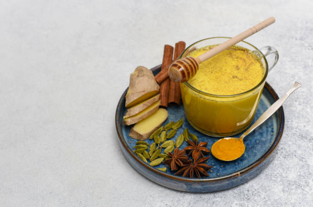 istock Turmeric latte and spices over on light background with copy space. 1224339833