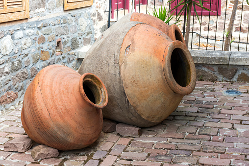 Two brown color old large clay amphorae in Lesbos, Greece.