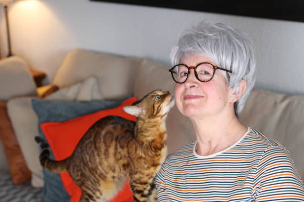 istock Senior woman showing complicity with her pet 1224341479