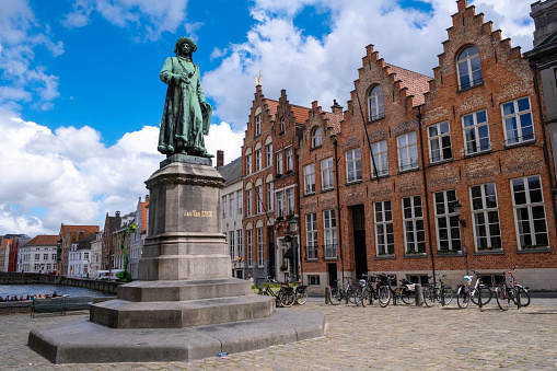 Statue in honor of the Flemish painter Jan Van Eyck in the historic center of Bruges. The famous artist worked for several years in the Belgian city, and died there.