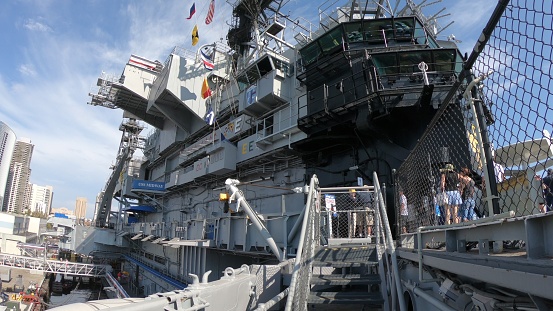 San Diego, Navy Pier, California, USA - August 1, 2018: entrance of USS Midway Battleship in San Diego California. Navy Pier of United States. National historic patriotic monument.