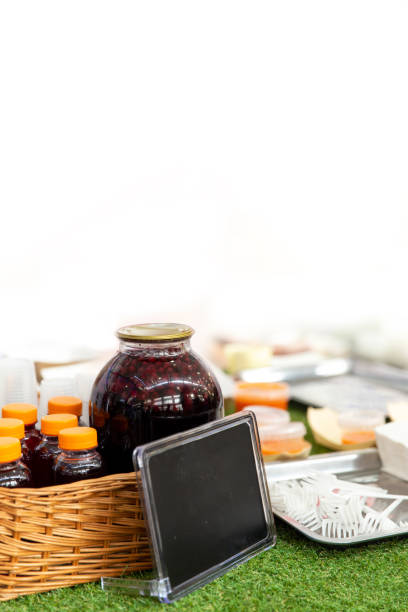istock Glass jar with tasty fruit drink and black plate for text 1224344177