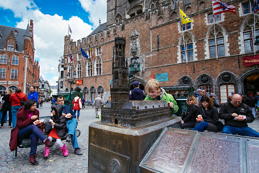 A child looks at a model of the Bruges Belfry, in the city's Markt square, one of the main tourist attractions in the historic center of the Flemish city.