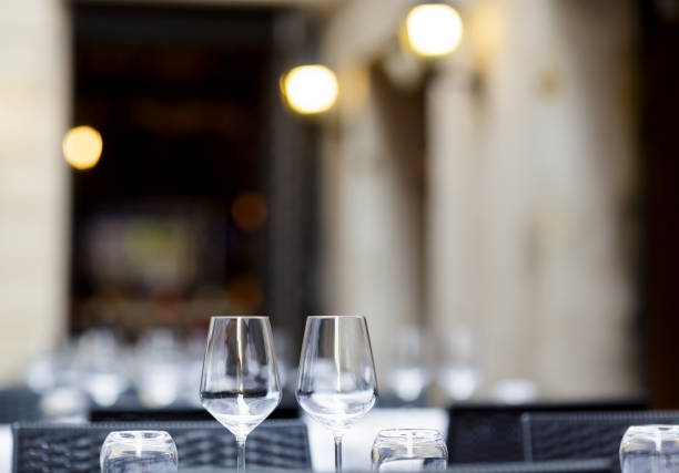 istock Two empty wineglasses on vacant restaurant table with selective focus on glasses 1224346667