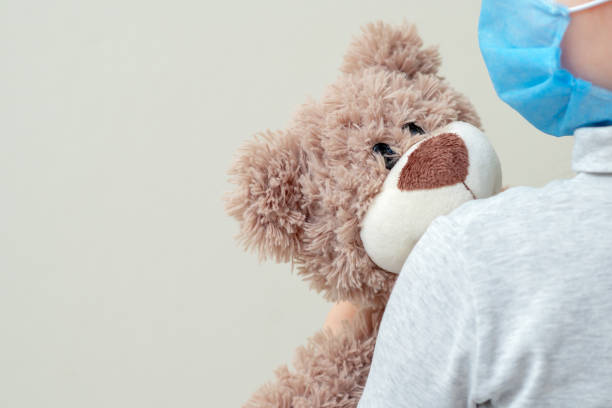 istock Toy bear in child hands. 1224353208