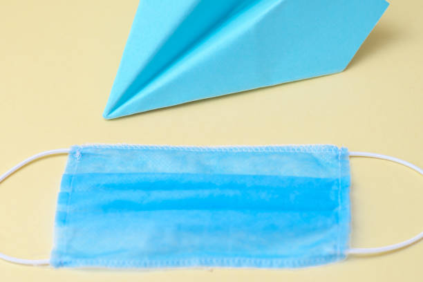 istock Paper airplane with medical mask. 1224353260