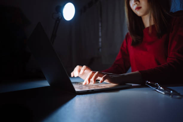 istock Hands of woman working late time at night typing keyboard laptop computer home office work hard overworked, Freelancer stay home business quarantine sleepless crisis coronavirus stay home dark room. 1224355487
