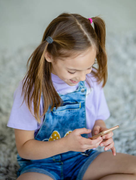 istock Young teenage girl using mobile 1224355540