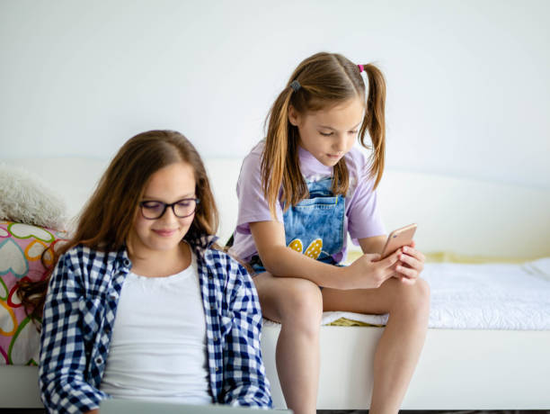 istock Two young teenage girls using technology 1224355565