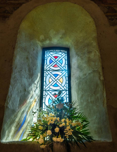 istock GB Church window flowers sunlight Jersey St Aubins 1224355992