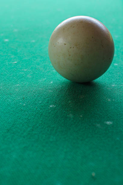 istock Old white snooker ball on the felt table 1224357597