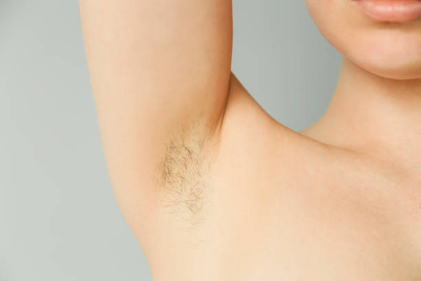 istock Woman's Underarm Hair Removal On Grey Background 1224357712