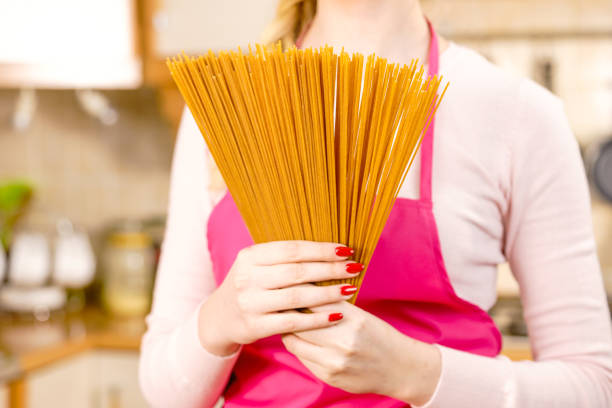 istock Woman holding long pasta 1224358516