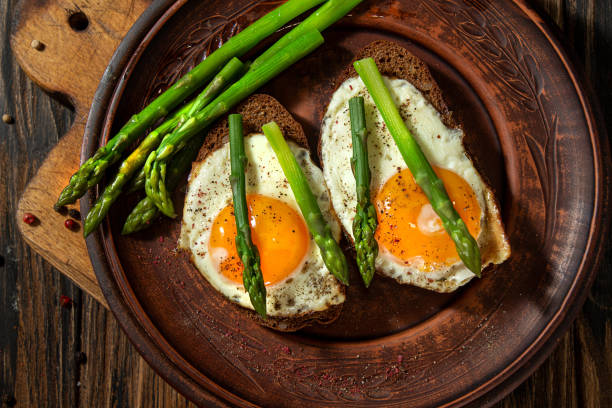 istock Delicious toast bread sandwiches with asparagus and fried eggs. 1224361536