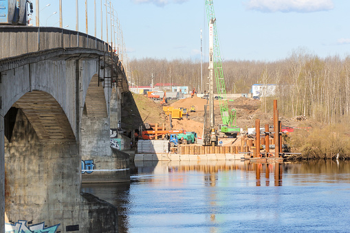 Kirishi, Russia - 8 May, 2020.\nStart of construction of a motor bridge over the Volkhov River.\nStart of construction of a new bridge.