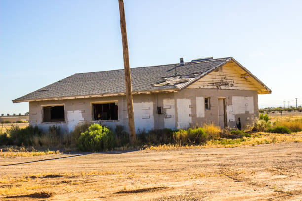 istock Abandoned Home In Disrepair With Broken Windows 1224367994