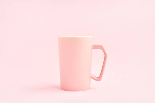 istock Pink cup of coffee on pink background. Copy space. Mockup 1224369641