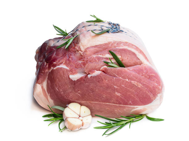 Loin of pork with spices ready for roasting isolated on white