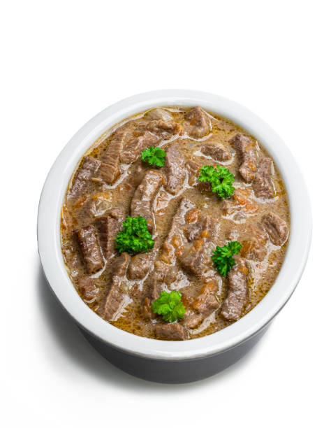 istock Beef stew with vegetable in clay bowl isolated on white 1224370704