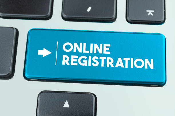 Close-Up Blue Laptop Keyboard With Online Registration Button. Close-Up Blue Laptop Keyboard With Online Registration Button. Horizontal composition with copy space. Technology and internet Concept. voter registration photos stock pictures, royalty-free photos & images
