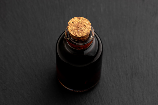 Bottled cold brew coffee on the black background.