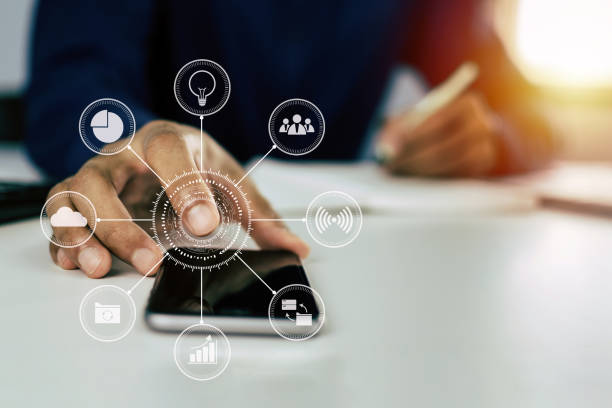 istock man hand working about financial on mobile phone with virtual digital icon and writing report on desk at home office, digital marketing, work from home, business finance, network technology concept 1224378527