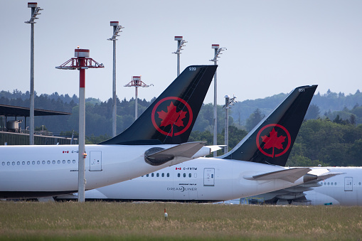 Zurich, Switzerland - May 10, 2020: Two Air Canada airplanes at Zurich Airport during the corona crisis.