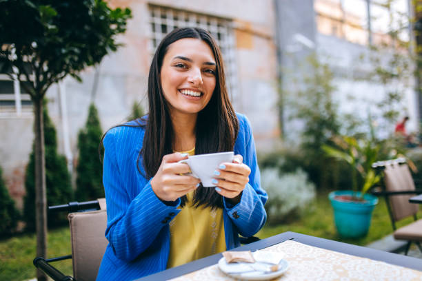 istock Pretty women at coffee shop 1224385380
