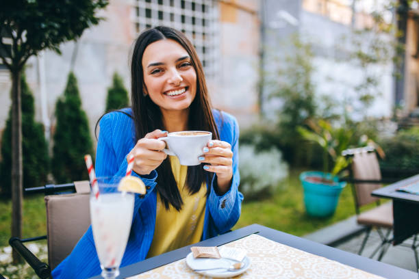 istock Pretty women at coffee shop 1224385438
