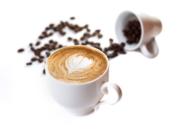 istock Coffee cup with art and beans on a white background 1224385615